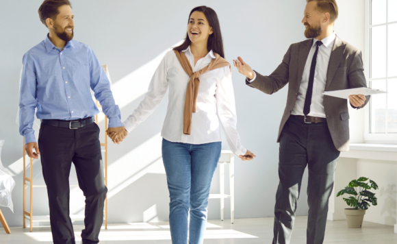 Prospective homebuyers receiving expert advice from their real estate agent in Durham Regio