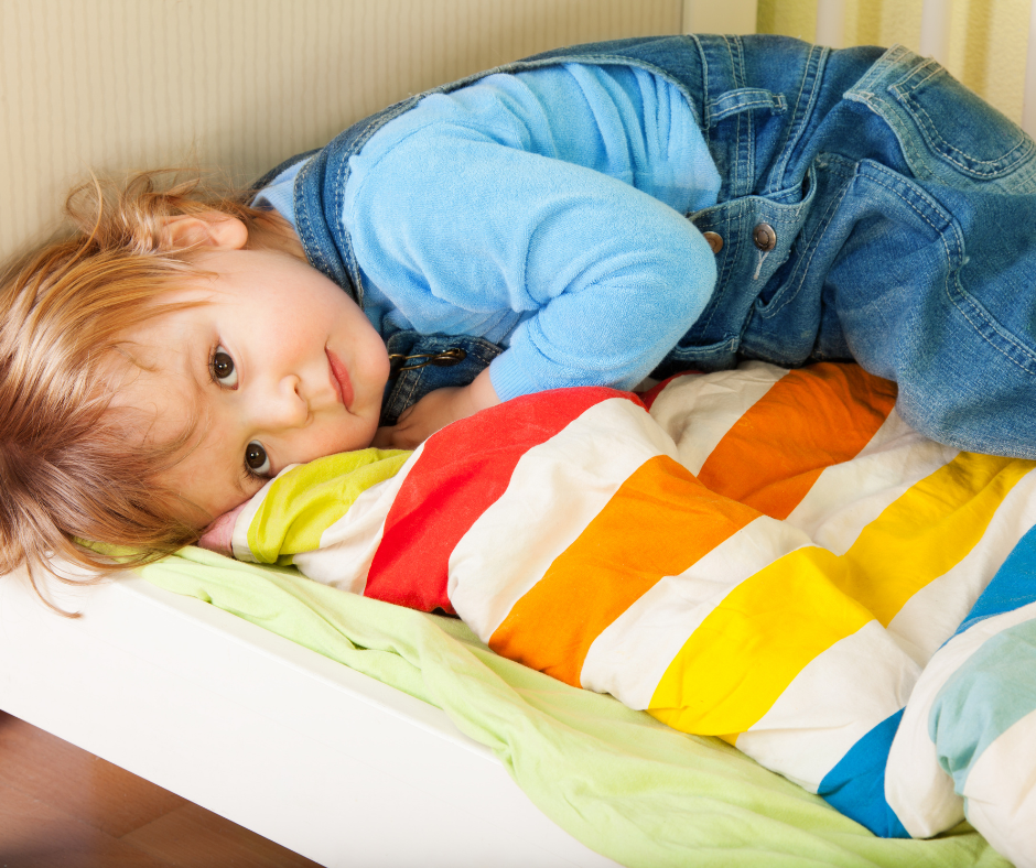 a toddler with a comfort blanket