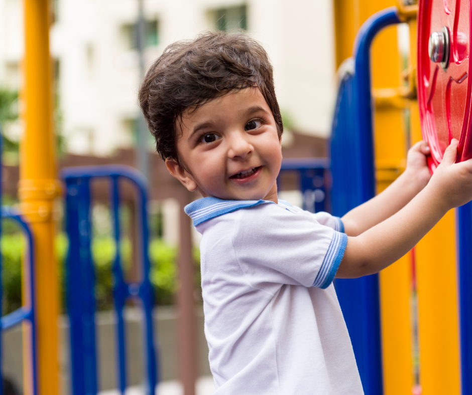  toddler playing in a playground