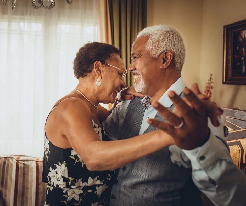 Couple dancing in their home